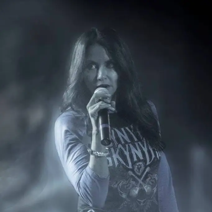 Stacey singing in smoke